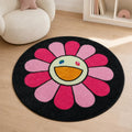 Alfombra redonda infantil con diseño de flor rosada y carita sonriente