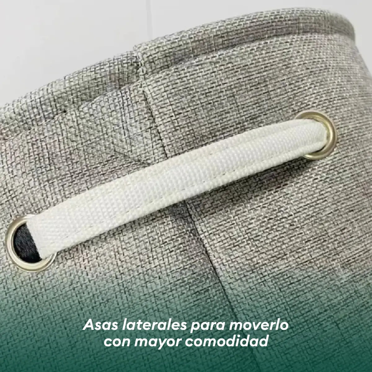 Detalle de las asas laterales reforzadas del cesto para ropa sucia para facilitar su transporte