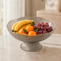 Frutero con drenaje color oscuro y base elevada para organizar diferentes frutas