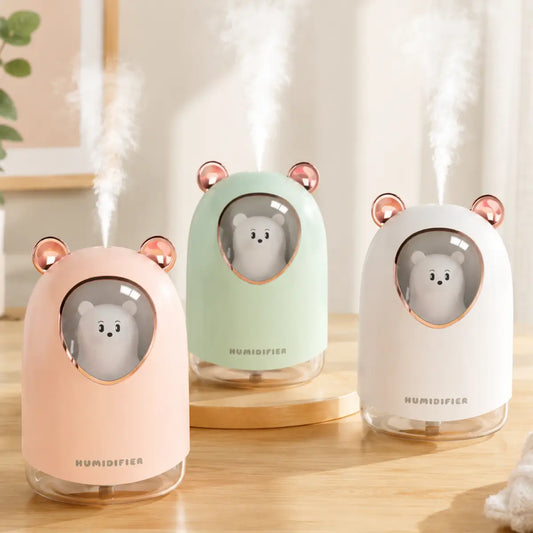 Humidificador con diseño de oso y luz LED disponible en colores rosado, verde y blanco