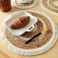Individual de mesa redondo de fibra natural con flecos para decorar y proteger la mesa