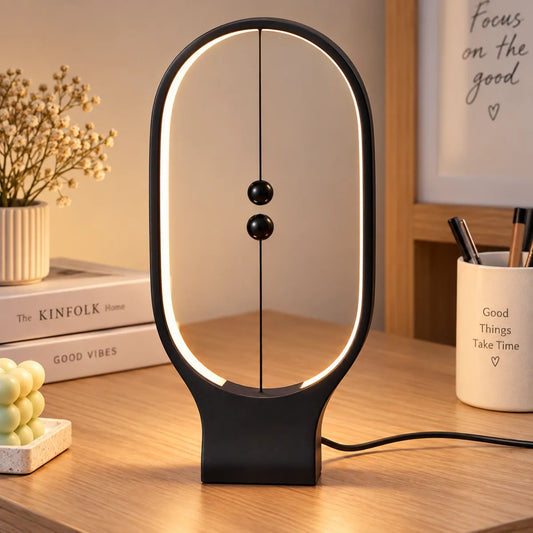 Lámpara LED magnética de mesa con diseño ovalado negro y dos esferas suspendidas